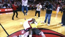 LeBron tackles a Heat fan who hits a $75,000 shot!.