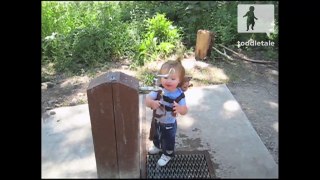Toddler is confused on how to turn on the faucet