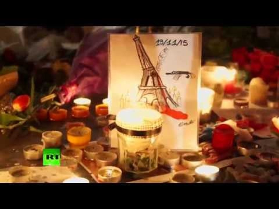 RAW: Parisians mourn with candles and flag tributes