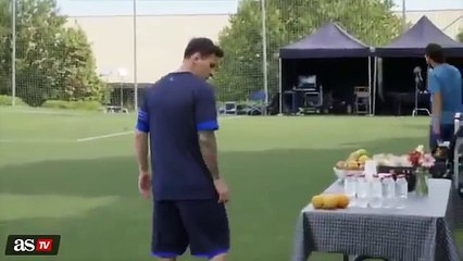 Messi doing keepy uppies with an orange