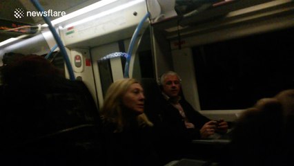 Wembley Stadium arch lit up in French flag colours