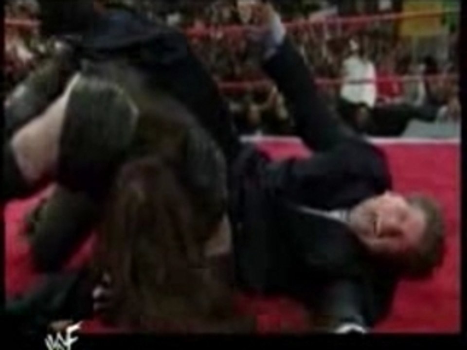 Undertaker and Kane break Vinces Leg
