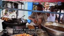 Man Fries Food With Bare Hands