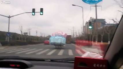 LiveLeak Lady laughs at cyclist hauling a very wide load in China