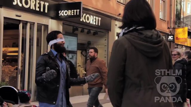 Muslim man blindfolds himself and asks strangers in Paris to hug him