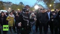 Blindfolded Muslim man hugs mourners in Paris