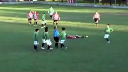 The football player knocks out referee