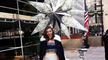 Miranda Kerr Raises Swarovski Star in New York City in Stunning Outfit