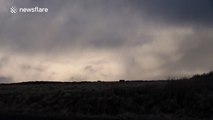 Dramatic winter clouds, snow and strong winds in Northern Ireland