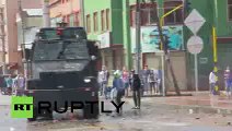 Clashes water cannons  tear gas reign as police seize illegal contraband in Bogota