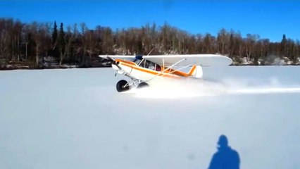 Airplane Lands On Frozen Lake, Does Donuts and Takes Off Again
