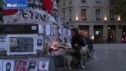 People gather at Place de la Republique to honour Paris victims