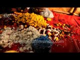 Colourful flower garlands for sale at market in Agra