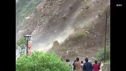 This hill may be about to collapse but NOTHING is going to stop us from standing right here and taking pictures!