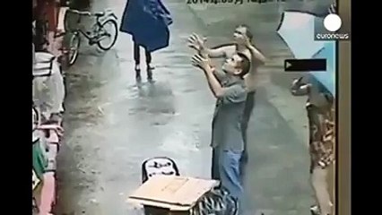 Two men catch a baby that fell out of a window