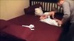 Mum and dad tries to change babies diapers