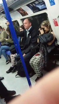 Man Brushing His Teeth in a London train. Funny!