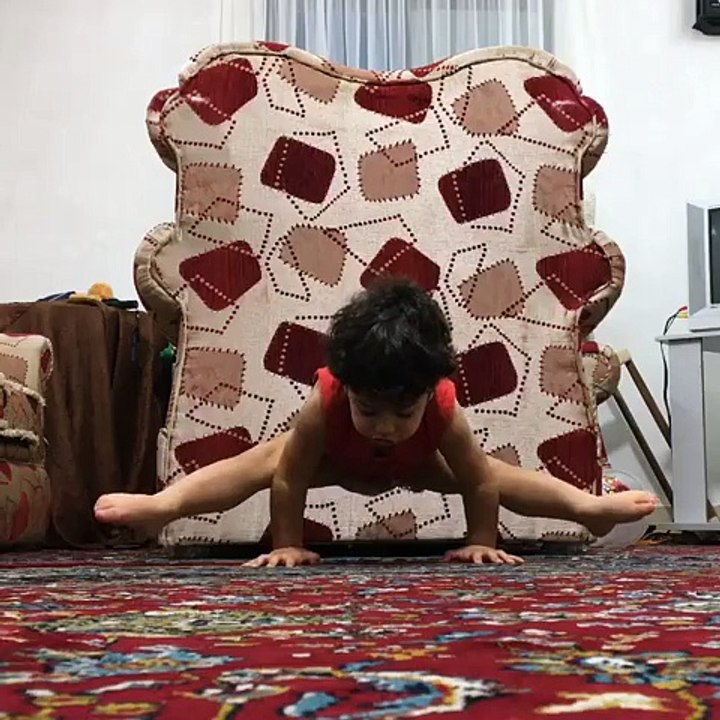 Little Boy Holds Himself Up Doing Splits