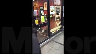 Child locked in Subway restaurant and dragged away by worker as friends try to smash door down