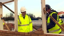 Osborne laying bricks at Housing Association