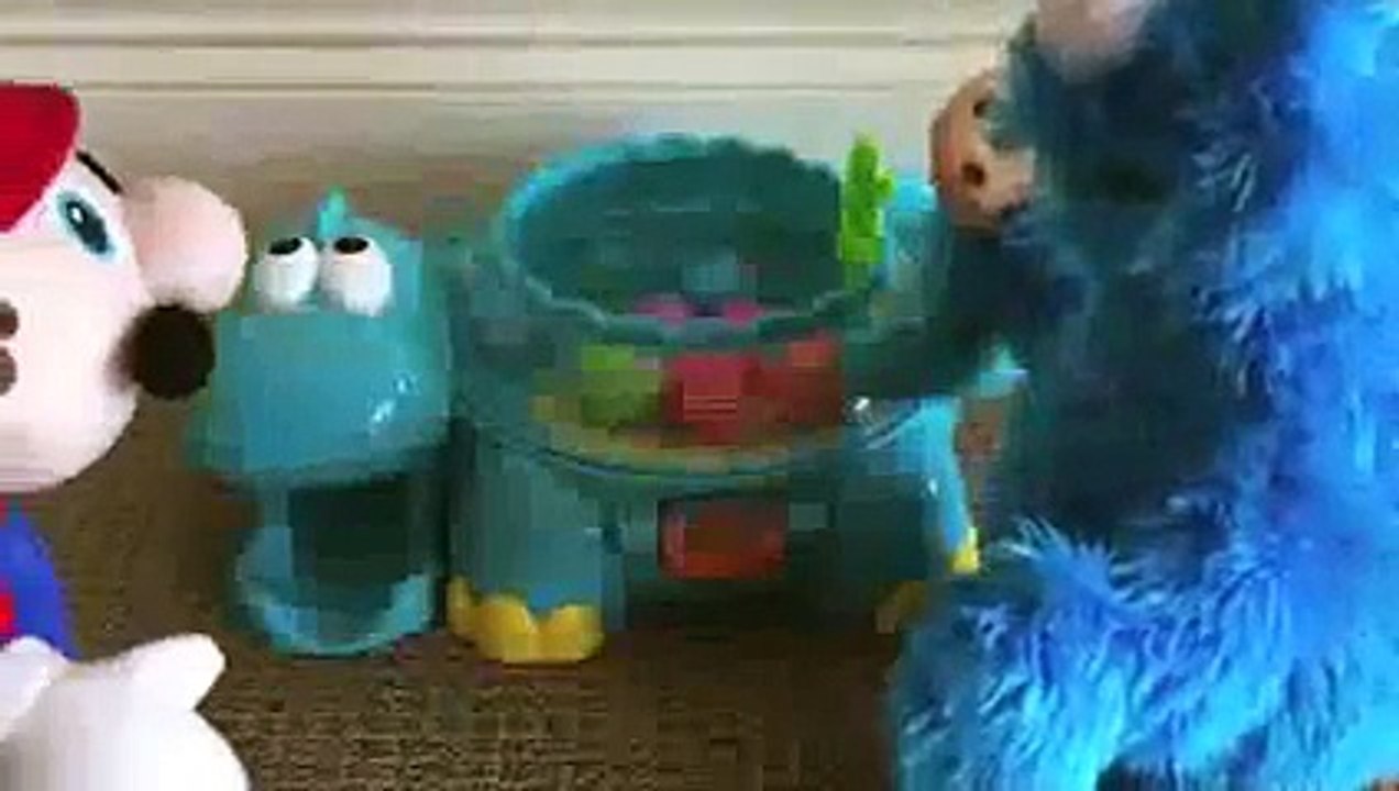 Mario vs Cookie Monster Poppity Pop Musical Dino Ball Popper Dinosaur made by Fisher-Price