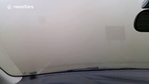 Severe dust storm engulfs car