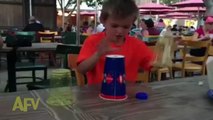Kid Magician Performs An Amazing Ball Under Cups Trick