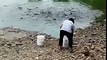 Chinese woman feeding the fish
