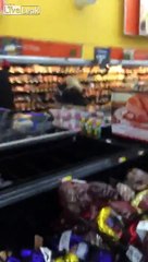 Two large butterballs fighting next to the holiday turkeys on offer at a New Jersey Walmart