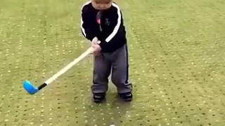 child playing the golf