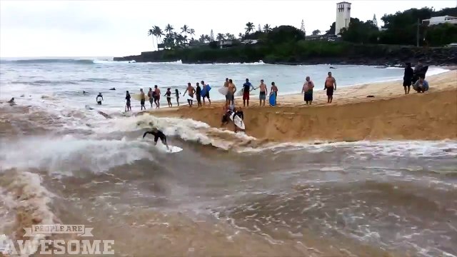 Surfing on a flooded river near the ocean
