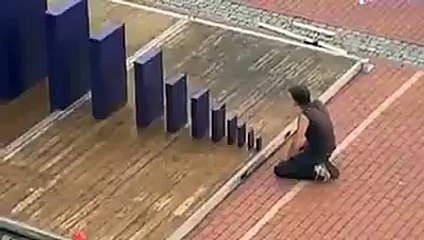 Use a little domino to bring down a giant domino... Amazing