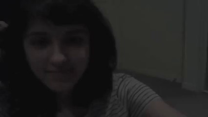 A cute girl singing admirable Indian song