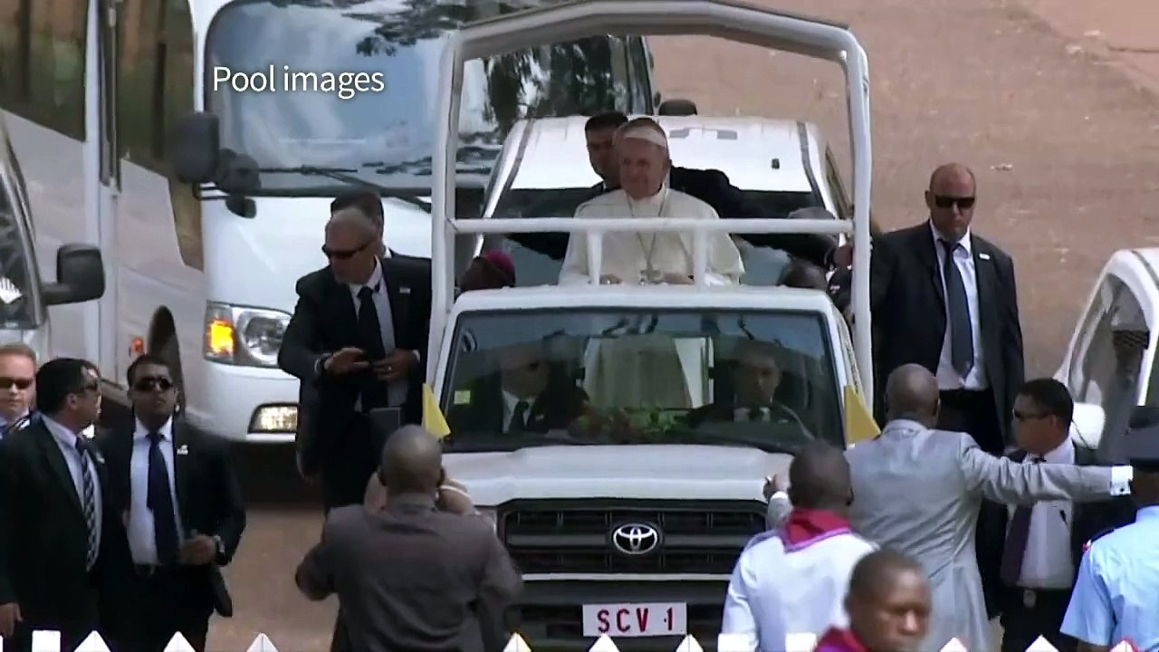 Pope Francis arrives at Bangui stadium for mass