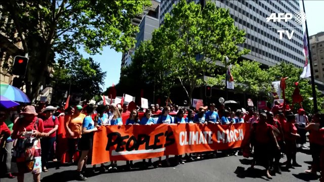 Thousands rally to call for action on climate change in Sydney