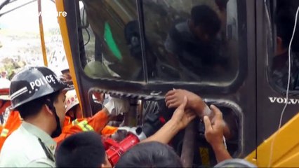 Driver saved after falling rock smashes digger
