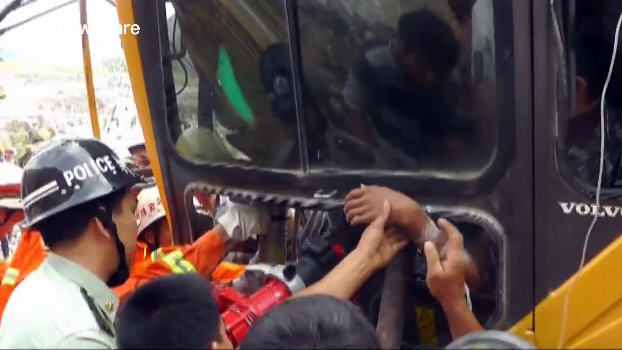 Driver saved after falling rock smashes digger