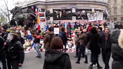 Riot police intervene during climate change public gathering in Paris