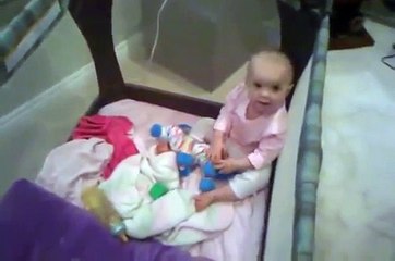 One-year-old talks her way out of a nap