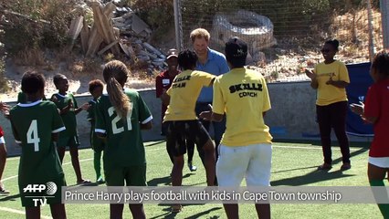 Prince Harry plays football with kids in Cape Town township