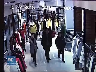 Caught on camera Man sneaks 7500 fur coat down his pants 2015