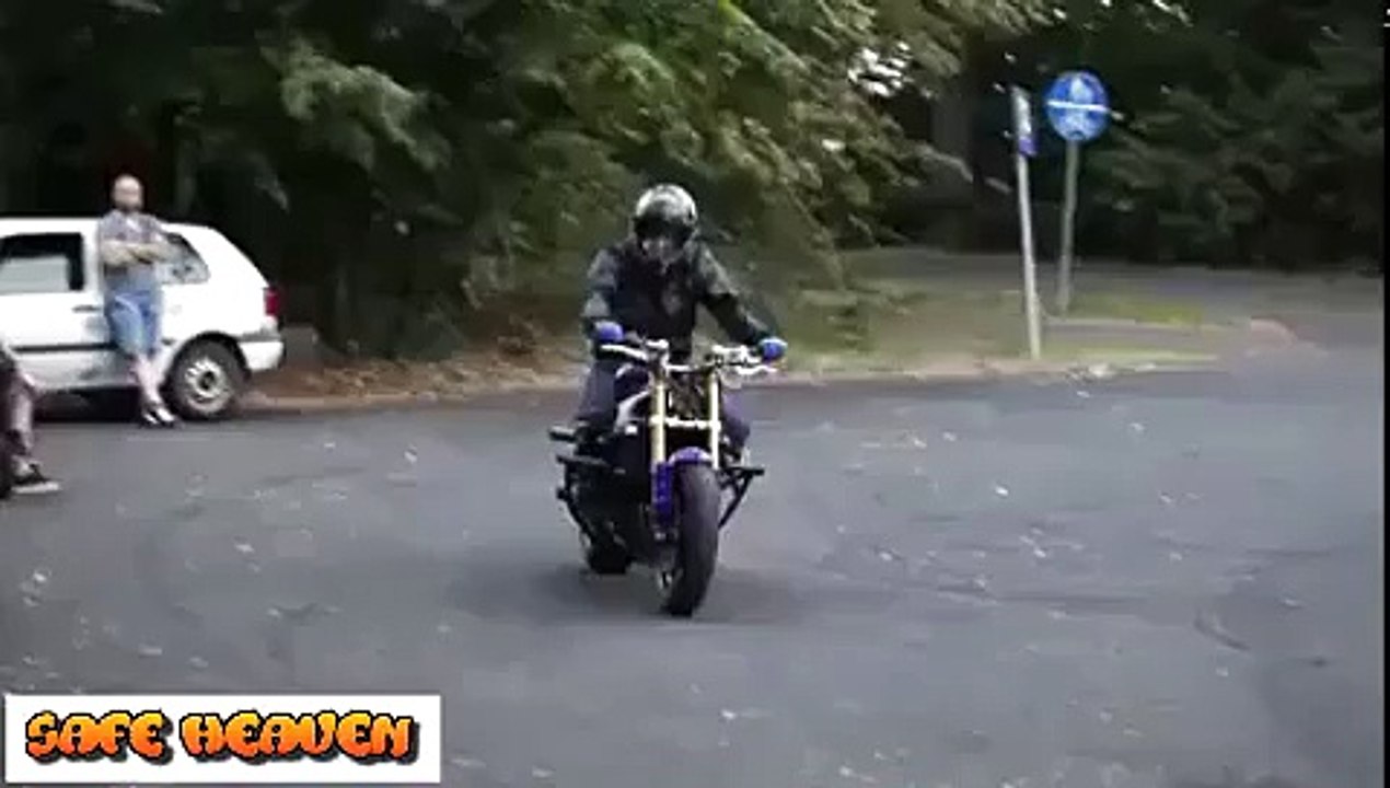 Crazy boy does motorcycle stunts NEW