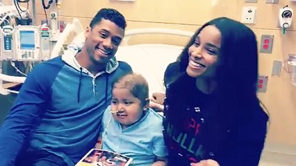 Russell Wilson & Ciara Sing “Feliz Navidad” to Boy at Children’s Hospital