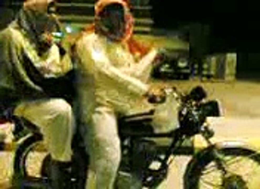 Two Mens Fall down from Bike While Performing a Stunt.