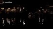 Light man jumps across river in parkour-style light show