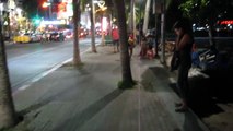 Pattaya Beach Road at night Woman selling on the beach