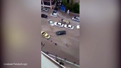 Man is nearly crushed by car in daring flood rescue attempt