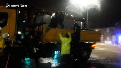 Family rescued from flooded home