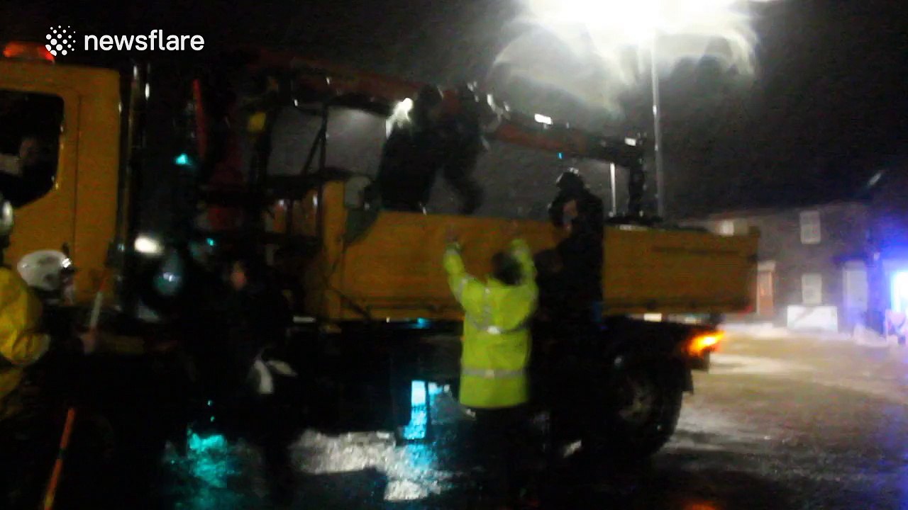 Family rescued from flooded home