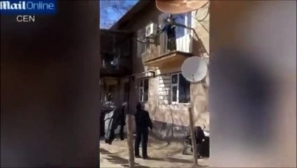 SHOCKING Lazy Mother Drops Toddler From Balcony Into Fathers Arms - Copie